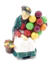 A Royal Doulton Old Balloon Seller figure group, 18cm high.