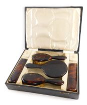 An imitation tortoiseshell dressing table set,