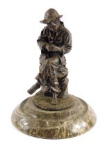 A spelter figure group of a seated gentleman holding mouse, on a circular moulded marble foot, 27cm