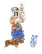 USSR and other porcelain, comprising a blue panda, brown bulldog, and a gentleman carrying oriental