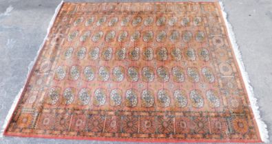 An Ankar Turkish rug, orange ground, with multi gul field, 213cm x 242cm.