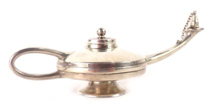 A continental white metal Aladdin's lamp table lighter, stamped Bagues, 18cm wide, 2.42oz gross.