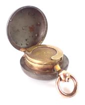 A steel sovereign case, with brass mechanism, and a gold plated swing top.