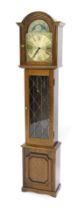 A Thwaites & Reed Big Ben replica clock, mahogany cased, with three weights, 180cm high.