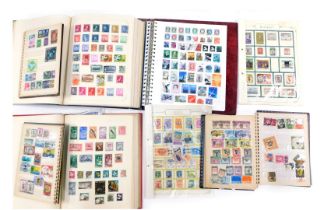 Philately. Three albums of world postage stamps, 19thC to modern, together with two stock books and