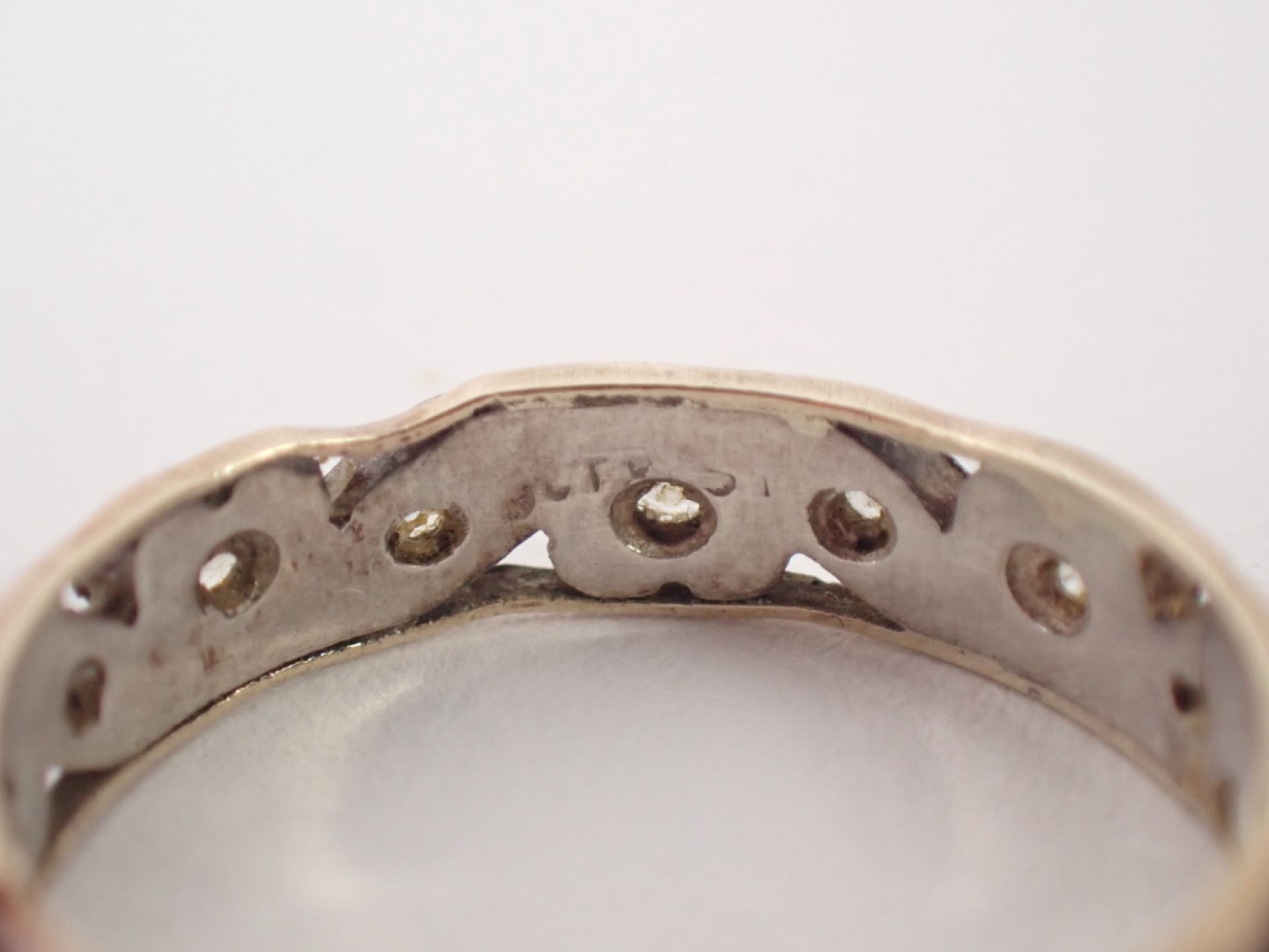 An eternity ring, with two panelled yellow metal outer border, and white gold centre, set with white - Image 2 of 2