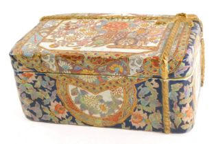 A 20thC Oriental rectangular box and cover, with floral design and raised gilt bow, with two charact