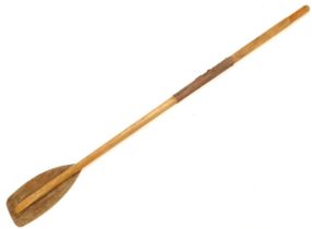 An elm oar, with part leather handle, 181cm high.