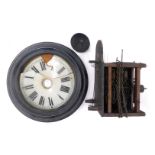 A late 19thC ebonised cased circular wall clock, dial bearing Roman numerals, two train movement wit