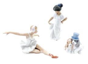 Three Nao figures, comprising girl with flowing dress, seated ballerina, and bride and groom pup. (3