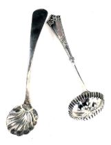 A George V tea strainer, with petalated border and a Victorian shell capped bowl and fiddle pattern