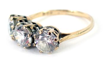 Withdrawn pre-sale. An 18ct gold three stone diamond ring, the round brilliant cut stones each