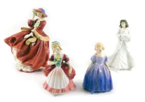 Four Doulton ladies, comprising Top of the Hill, Christmas Day, Valerie, and Marie.