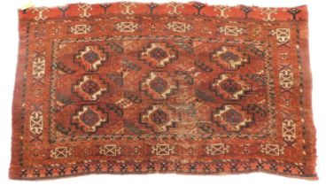 A Bokhara rug, on red ground, with multi gul field, 143cm x 87cm.