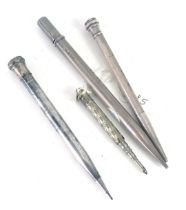 Four white metal and plated pencil sleeves, comprising a steel top stamped sterling silver, a 1946 h