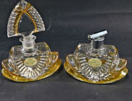 Two Bleikristall empty perfume bottles.