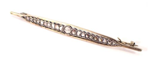 An Art Deco style bar brooch, of shaped boat form, set with diamonds, on white metal,