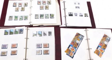 Philately. Four Stanley Gibbons albums of Great Britain collections, 1970s, 1980s, 1990s, and millen