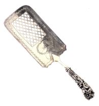 A George III silver cake or fish slice, with a cherub and vine moulded handle, on rectangular pierce