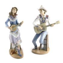 A pair of Lladro country music players, comprising lady with banjo and gentleman with guitar, seated