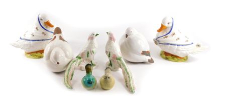 A group of mixed ceramic birds, comprising French Faience style hen baskets, stoneware birds, stonew