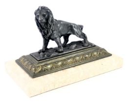 A 20thC spelter figure group, of a lion on brass and a cream marble plinth, 11cm high, 16cm wide, 9c