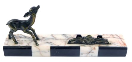 A French marble Art Deco stand, with black and cream marbling, with applied spelter deer, 14cm high,