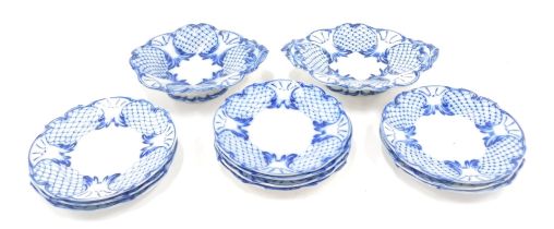A 19thC Pearlware part service, comprising two raised plates and ten side plates, each with blue lat