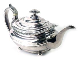 A Victorian silver teapot, with acanthus leaf handle, and rectangular rose moulded top, with a flute