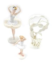 Three ceramic figures, comprising a Royal Doulton Little Ballerina, 16cm high, a Franklin Mint Swan