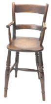 A Victorian ash and elm child's high chair, with bar back, and turned framing.