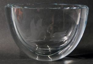 An Orrefors glass vase, with engraved swan design, on two ribbed shaped bowl, signed Orrefors and nu