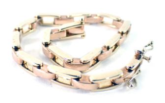A 9ct gold bracelet, of two colour design with rose and yellow gold, with clip clasp and double safe