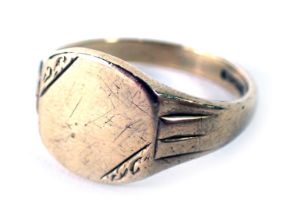 A 9ct gold signet ring, with rectangular panel, with scroll borders and hammered shoulders, ring siz