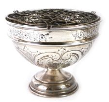 A George V silver rose bowl, embossed with flowers and rococo scrolls, maker unknown, Birmingham 193