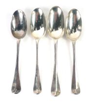 Four George IV silver fiddle pattern table spoons, each bearing the initials to include JHW, CW, HS,