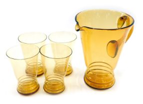 An amber glass lemonade jug and four tumblers.