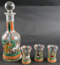 A Czechoslovakian style decanter set, with clear glass with green and red painted decoration, compri