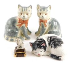 A pair of Rye pottery cats, each on grey and cream ground with pink bows, 19cm high, a seated cat un