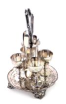 A 19thC silver plated egg cup stand, of floral design, with later silver teaspoons, spoons 2.01oz.