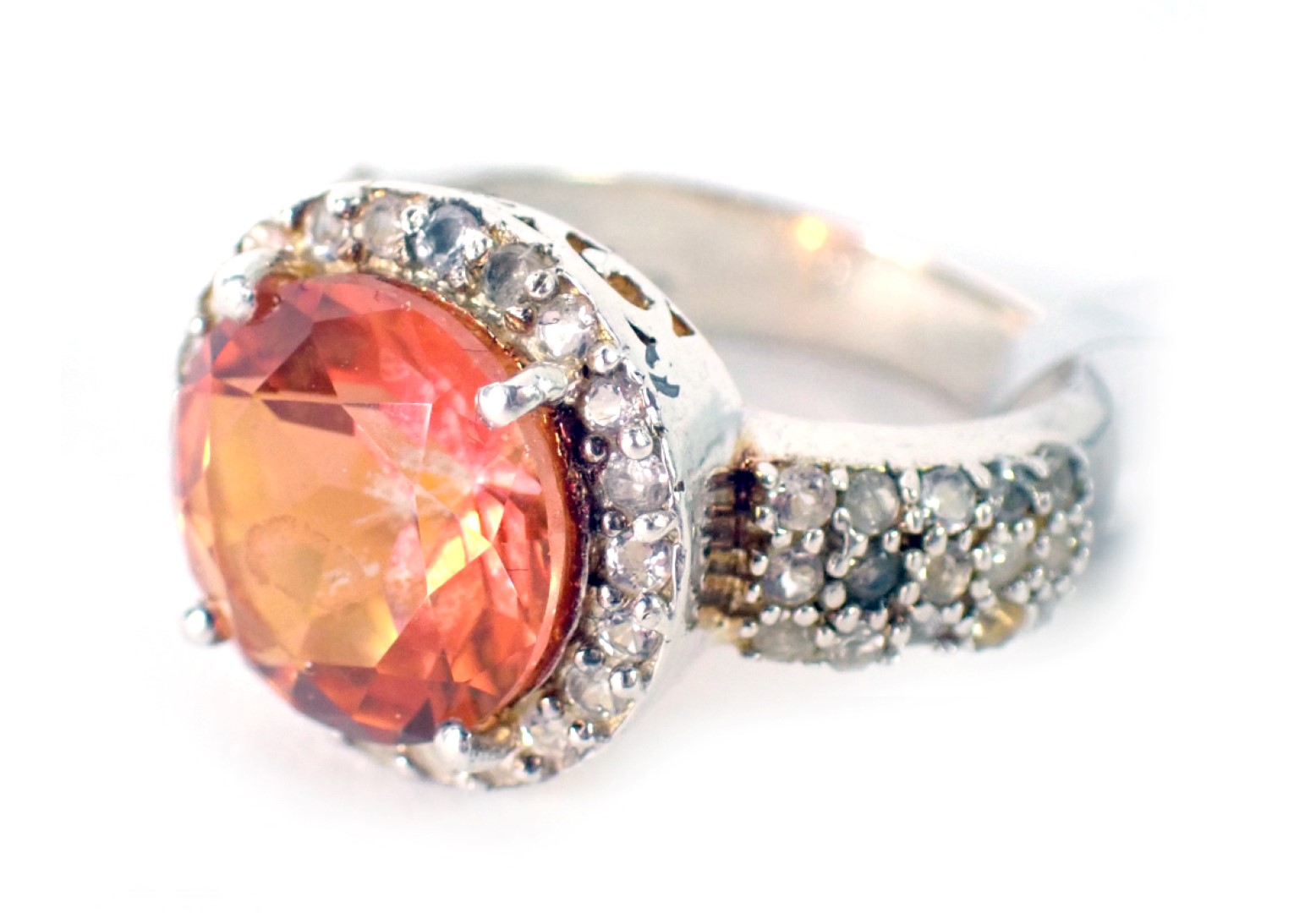 A padparadscha quartz and white topaz dress ring, of chunky design, white metal stamped 925, ring si