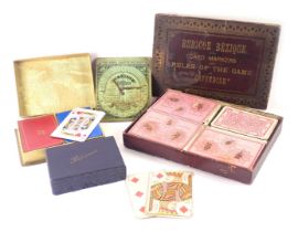 A group of playing cards, comprising Rubicon Bezique card makers, patience card game, and a further