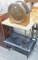 A 1960s black leatherette stool, side table, and a brass formica coffee table. The upholstery in thi