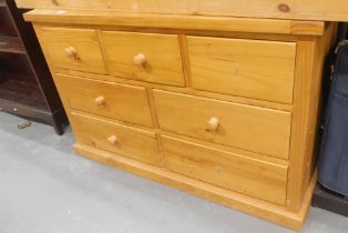 A pine chest of three short and four long drawers, 77cm high, 120cm wide.