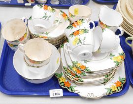A Wellington china part tea service, decorated with orange and yellow flowers. (1 tray)