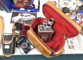 A Kodak brownie movie camera and case, Canon AG1 and flash.