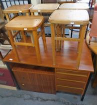 An office desk, cabinet, and five stools.