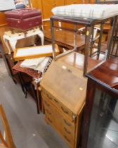 A walnut student's bureau, smoky glass topped table, deck chair, side table, cushioned stool, two ti