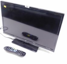 A JVC 24" flat screen television with remote.