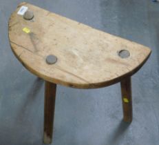A 19thC pine milking stool.